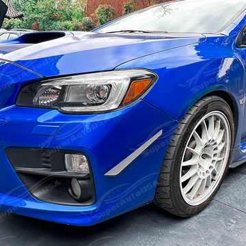 Aggressive carbon print front bumper aero canards installed on a 2016 Subaru WRX STI