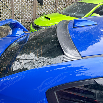 Aggressive carbon print rear window spoiler installed on a 2017 Subaru WRX STI