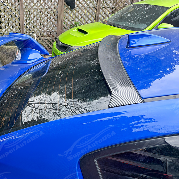 Aggressive carbon print rear window spoiler installed on a 2017 Subaru WRX STI