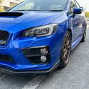 Direct front-facing view of the gloss black fog light bezel overlays for 2015-2017 Subaru WRX