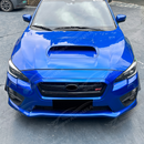 Direct front-facing view of the symmetrical gloss black bumper winglets for 2015-2021 WRX
