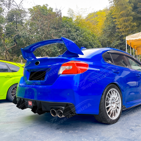 Pair of gloss black rear diffuser shark fin splitters installed on a 2018 Subaru WRX STI VA