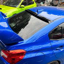 Gloss black rear window visor roof spoiler installed on a 2018 Subaru WRX STI VA