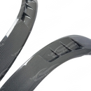 Low angle view emphasizing the carbon fiber fender flares