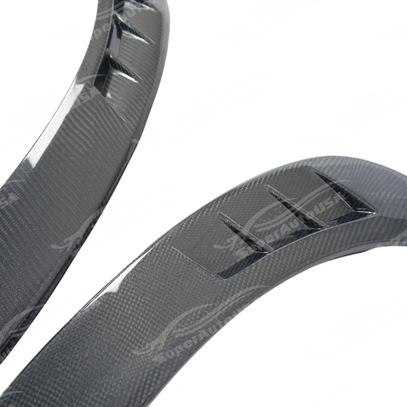 Low angle view emphasizing the carbon fiber fender flares