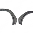 Carbon fiber fender flares integrated on a black Subaru WRX VB