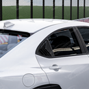Side perspective highlighting the aerodynamic profile of the carbon print rear quarter trim
