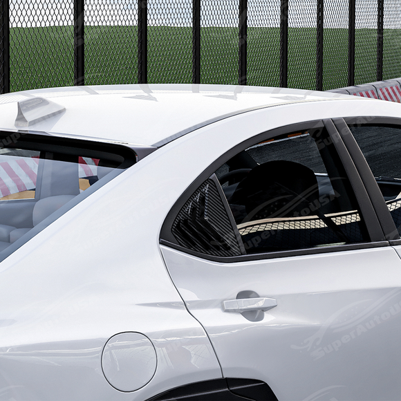 Side perspective highlighting the aerodynamic profile of the carbon print rear quarter trim
