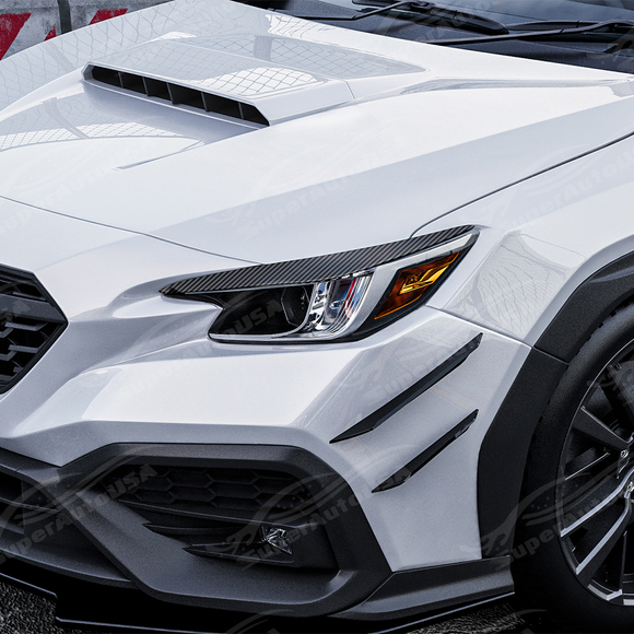 Carbon print headlight eyelid overlays installed on a 2022 Subaru WRX VB