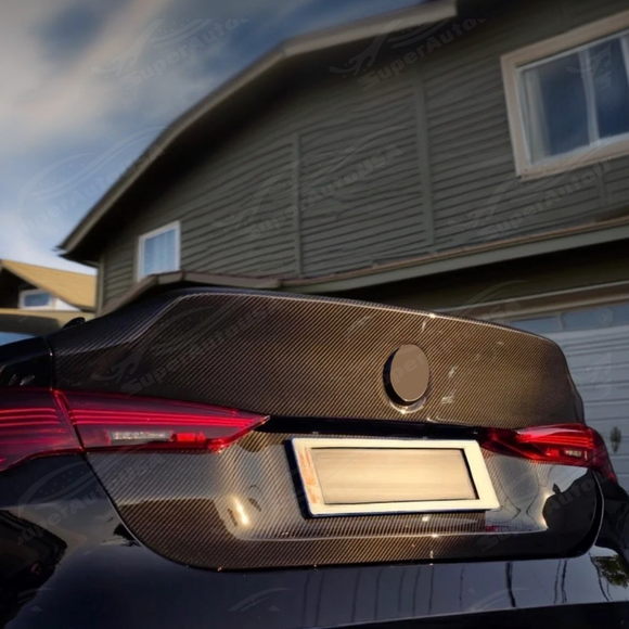 2022 BMW G22 M440i carbon fiber rear trunk replacement by SuperAutoUSA.
