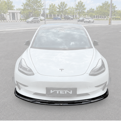 SuperAutoUSA VTEN style 1-piece gloss black front bumper lip splitter installed on a 2017-2023 Tesla Model 3