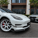 Stealth performance look of the SuperAutoUSA VTEN gloss black 1-piece bumper lip accenting a Solid Black Tesla Model 3