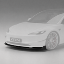 SuperAutoUSA VTEN style 1-piece gloss black front bumper lip splitter installed on a 2024-2026 Tesla Model 3 Highland