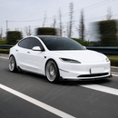 Stealth look of the SuperAutoUSA VTEN gloss black 1-piece bumper lip accenting a Solid Black Tesla Model 3 Highland