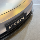 Stealth look of the SuperAutoUSA VTEN gloss black 3-piece bumper lip accenting a Solid Black Tesla Model 3 Highland