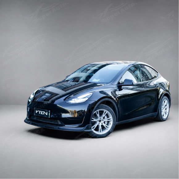 High-gloss black SuperAutoUSA VTEN front lip creating a sharp contrast on a Pearl White Multi-Coat Tesla Model Y