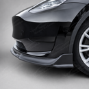 Stealth look of the SuperAutoUSA VTEN gloss black bumper lip accenting a Solid Black Tesla Model Y