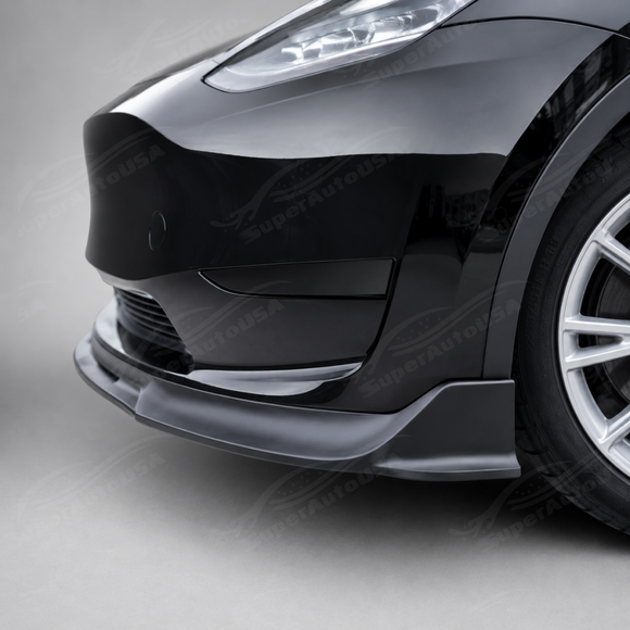 Stealth look of the SuperAutoUSA VTEN gloss black bumper lip accenting a Solid Black Tesla Model Y