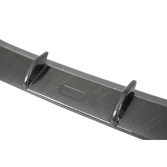 Detailed shot of the UV-resistant high-gloss clear coat on the Toyota GR86 carbon lip