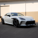 Full 3/4 front view of a 2023 Toyota GR86 featuring a high-gloss real carbon fiber lip kit