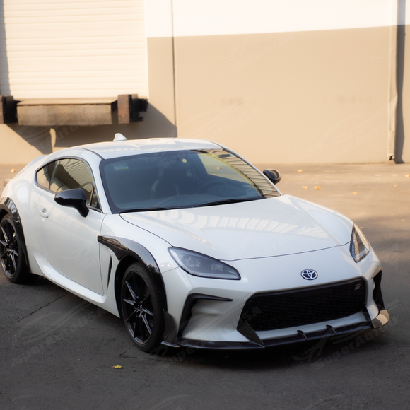 Low angle view showing the aggressive track-ready ground clearance of the GR86 carbon splitter