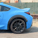 Front fender flare wheel trims on a white Toyota GR86