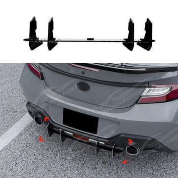 Gloss black V-style rear bumper shark fin diffusers installed on a 2022 Toyota GR86.