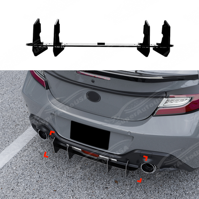 Gloss black V-style rear bumper shark fin diffusers installed on a 2022 Toyota GR86.