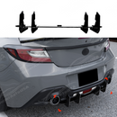 Close-up of the high-gloss shark fin vertical stabilizers on the 2024 Subaru BRZ rear bumper.