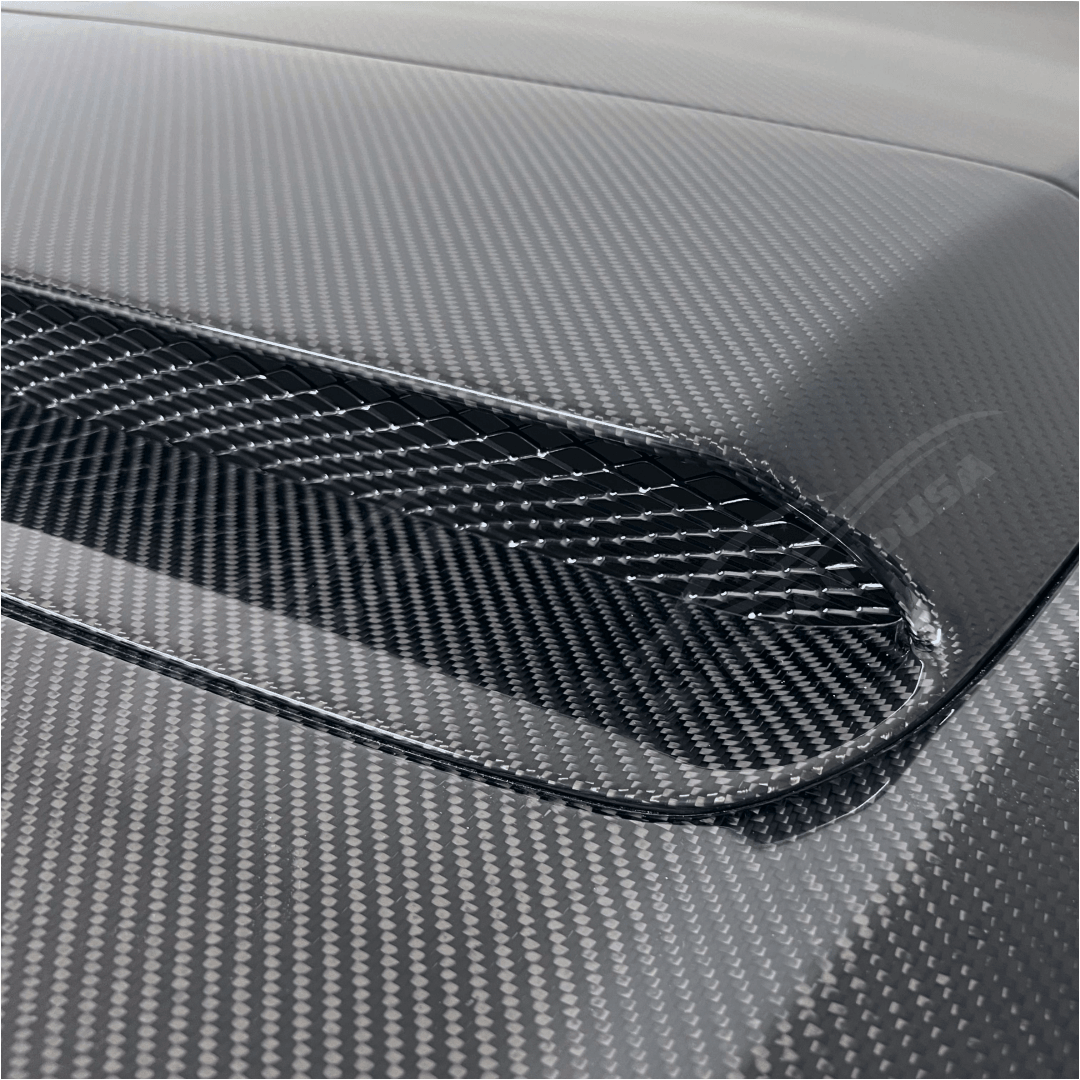 Artistic view highlighting the Real Carbon Fiber Front Engine Hood on the Subaru WRX 2022-2024, showcasing the blend of strength and elegance