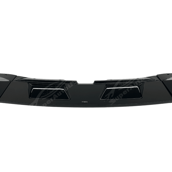 Angled view of the BMW G05 X5 M Sport with its gloss black front splitter spoiler lip, accentuating the vehicle's sporty contours