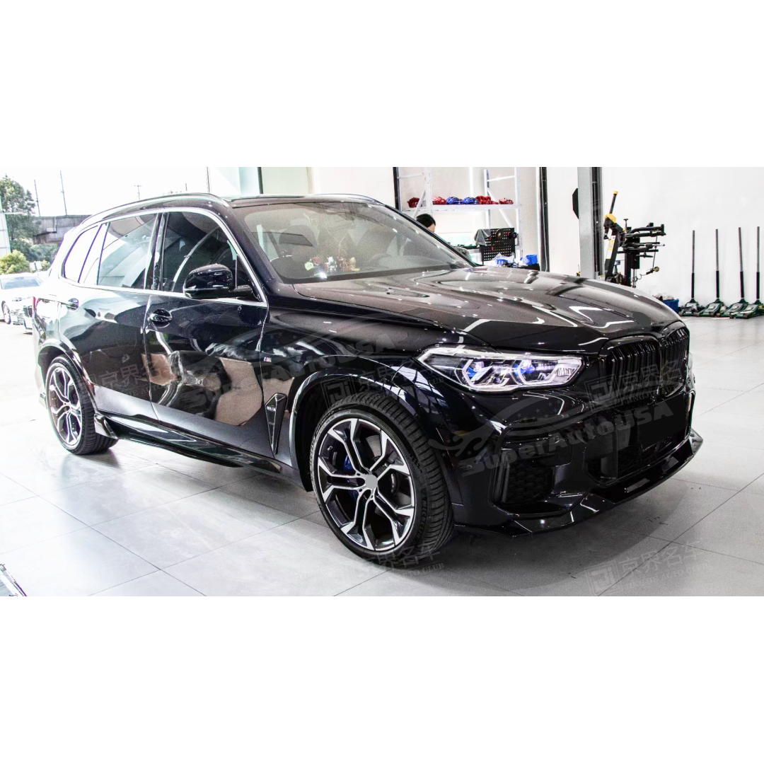 Close-up view of the Fits 2019-2023 BMW G05 X5 M Sport with a gloss black front splitter spoiler lip, enhancing the vehicle's aerodynamic profile