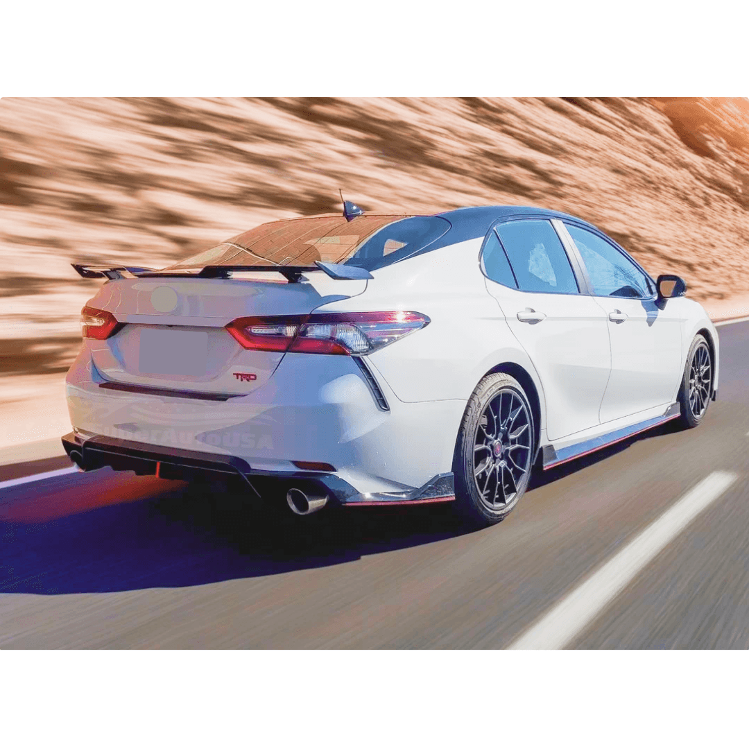 Side view of the Toyota Camry with a PP valance bumper with screws, part of the Universal Rear Bumper Corner/Splitter Lip Wing kit, for a customized look.