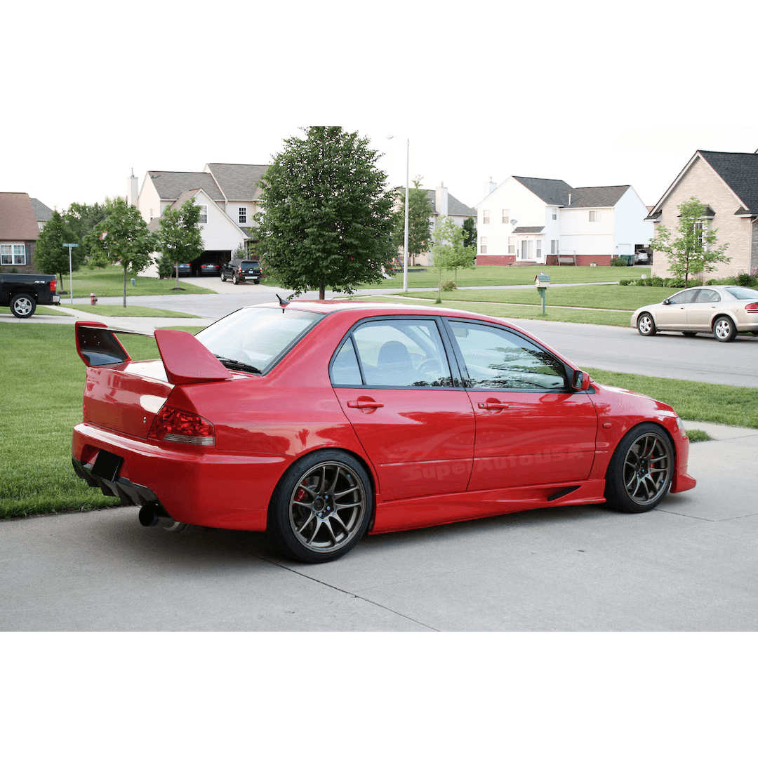 Installation view of the side skirt splitter set in PU black on a 2001 2002 2003 2004 2005 2006 2007 Mitsubishi Lancer Evolution EVO 7 8 9 , illustrating the perfect fit and enhanced body lines.