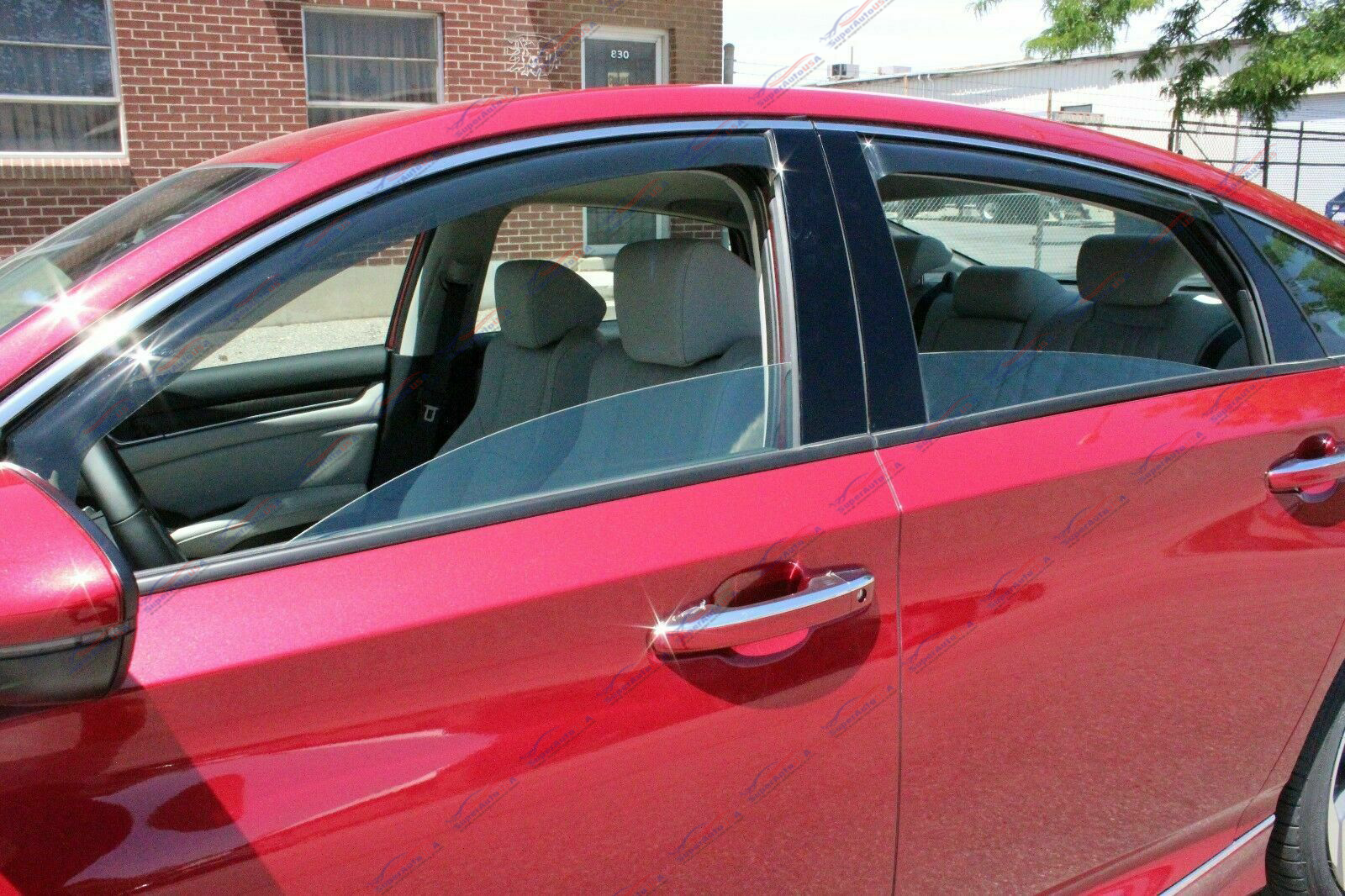 Installation detail of the In-Channel Vent Window Visors Rain Guards on the 2011-2023 Forte Hatchback, offering both rain protection and shaded comfort