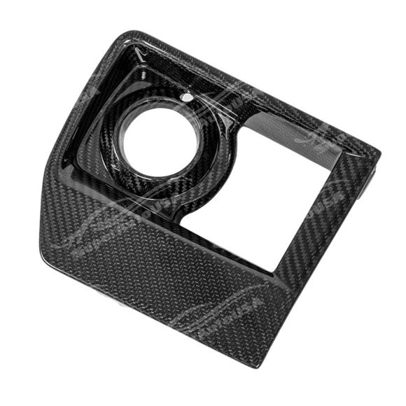 Carbon fiber fog light bezel on a white Cadillac CTS