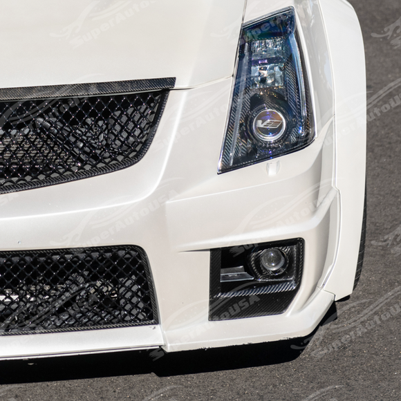 Carbon fiber fog light bezel integrated on a black Cadillac CTS-V