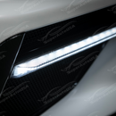 Corvette C8 in motion with illuminated Carbon Flash Metallic LED DRL light bar bezel