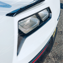 Carbon fiber tail light bezels integrated on a black Corvette C7