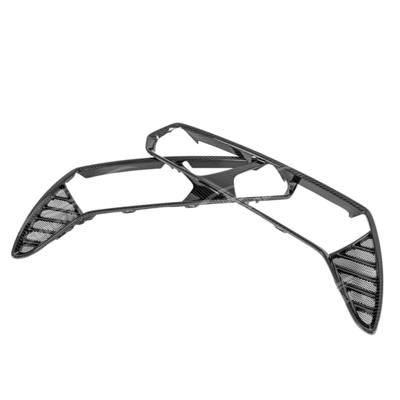 Carbon fiber rear tail light bezels on a white Corvette C7