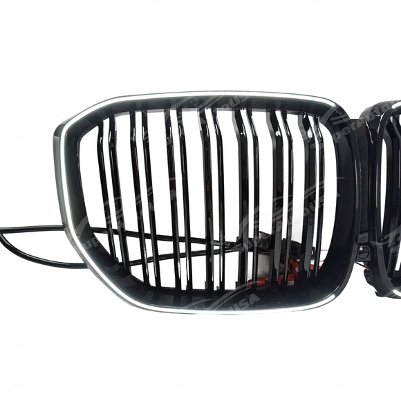 BMW X5 G05 in motion with illuminated front grilles insert