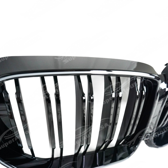 Low angle view emphasizing the gloss black LED grilles insert on X5 G05