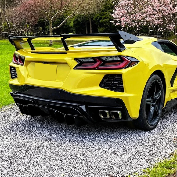 Rear lid roof spoiler wing on a yellow Corvette C8