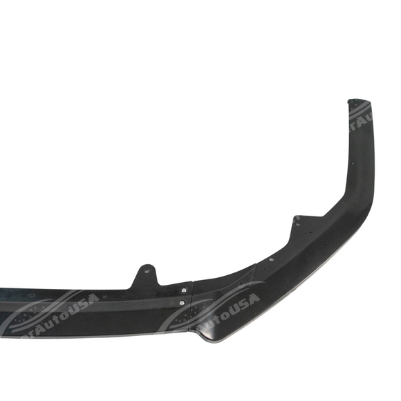 Toyota Camry in motion with front lip spoiler