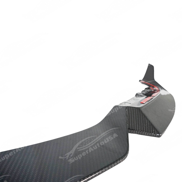 Carbon fiber front lip integrated on a black BMW G87 M2