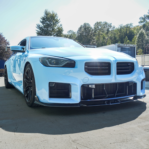 Sleek carbon fiber front splitter installed on BMW G87 M2