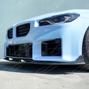 Carbon fiber front lip splitter on a white BMW G87 M2