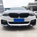 High-contrast motorsport styling of the deep gloss black front splitter mounted on an Alpine White BMW G30